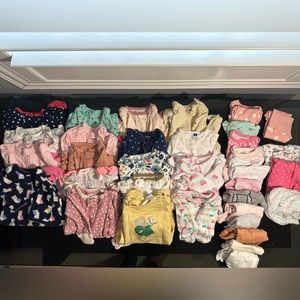 Newborn clothes. Pajamas, onesies, rompers